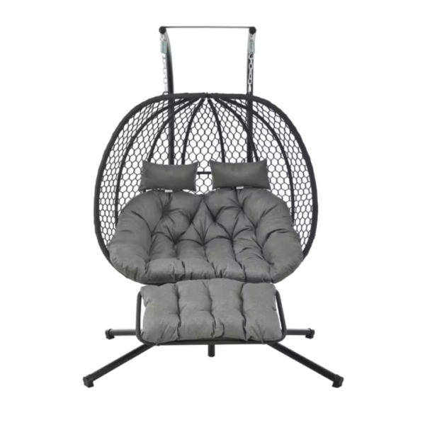 Fauteuil suspendu gris anthracite avec structure noire, coussins épais fonvés et extension repose-pieds.